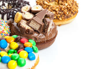 various donuts on white background