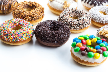Delicious donuts with icing isolated on white
