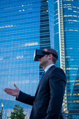 Businessman using virtual reality glasses for a meeting in cyber