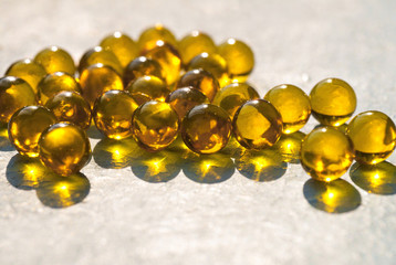 fish oil capsules/ yellow fish oil capsules closeup, pharmacy