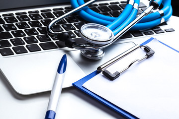 Medical stethoscope on computer keyboard