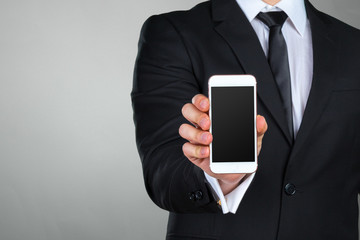 Close up of a businessman using mobile smart phone
