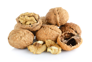 walnut and a cracked walnut isolated on the white background
