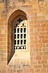 The old window of the medieval church in Otranto, Italy with the Baroque style.