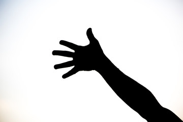 Silhouette of a team of people hands shows gesture ok