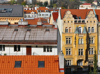 Fototapeta na wymiar Frontal view of the panorama of the district Vysehrad, Prague, Czech Republic. Various ancient roofs and facades.