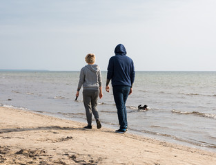 Couple walking with a dog