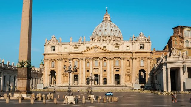 St. Peters Basilica in the morning in Vatican City - the most famous square almost empty of people in the area, blue cloudless sky at the background. Hyper-lapse
