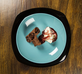 Cannoli with ice cream, chocolate and almonds