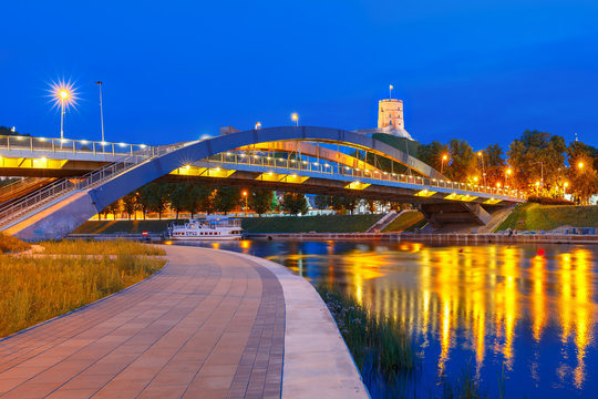 Night Gediminas Tower and King Mindaugas Bridge across Neris River in the city Vilnius, Lithuania, Baltic states.