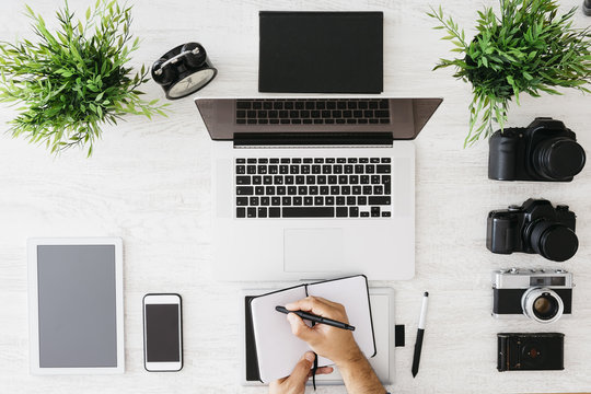 Photographer Working At Desk , Top View