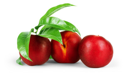 Nectarine organic fruits with leaves on white background.