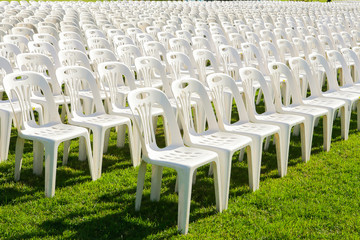 Fototapeta premium Rows of empty white chairs waiting for the audience