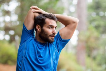 Man exercising in forest