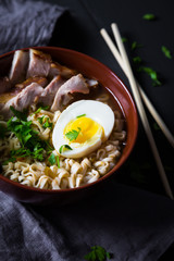 Asian noodles with pork, egg and greens