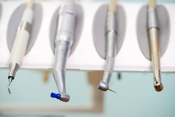 Naklejka premium Stomatological instrument in the dentists clinic. Operation, tooth replacement.