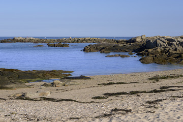 Beach on the rocky wild coast (Côte sauvage in French) of Le Pouliguen in Pays de la Loire region in western France