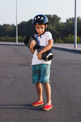 Boy stands with black gyro scooter outdoors