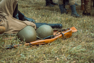 Historical reconstruction second world war. Helmet and rifle.
