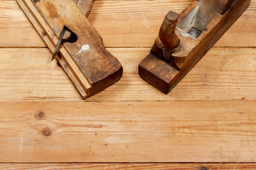 Two old planes from a tree on wooden boards