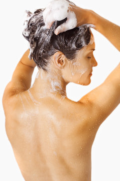 girl washing her hair with shampoo