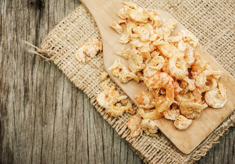 Dried shrimp on wooden spoon vintage style