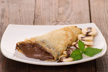 Crepes with chocolate cream and banana