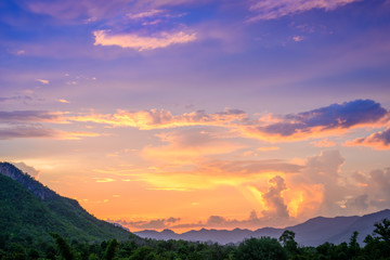 Fototapeta na wymiar Majestic sunset in the mountains landscape. Overcast sky.