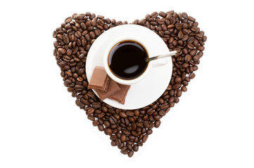 white cup of coffee on  beans as a heart