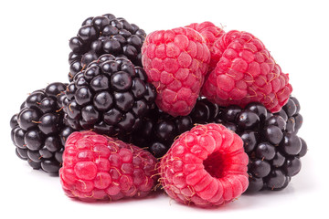 pile of raspberries and blackberries isolated on white background