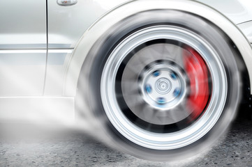 Racing car burning front wheel, sport action