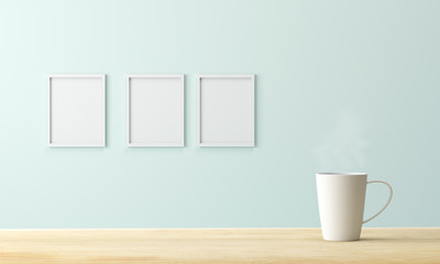 white coffee cup on wood table and empty picture frame