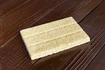 Brittles sesame,closeup Noah wooden background.