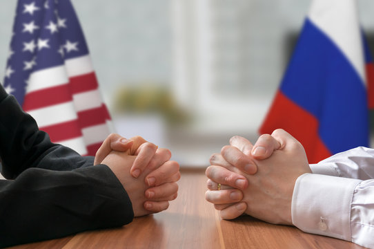 Negotiation of USA and Russia. Statesman or politicians with clasped hands.