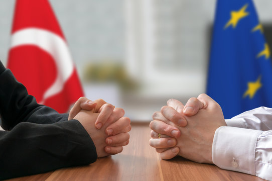 Negotiation of Turkey and European Union. Statesman or politicians with clasped hands.