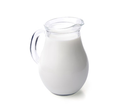Milk in a glass jug isolated with clipping path.
