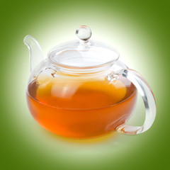 Teapot glass with tea bag isolated on a white background with clipping path. Front view.
