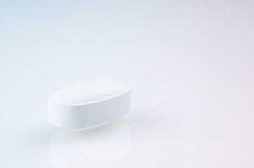 White medicine antibiotic pills