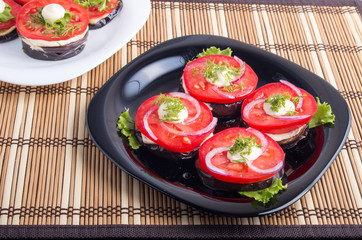 Vegetarian dishes of stewed eggplant and fresh tomatoes
