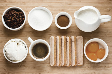 Tiramisu ingredients on wooden background