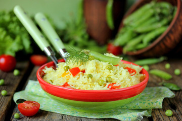 Dietary pilaf of basmati rice with paprika and green pea