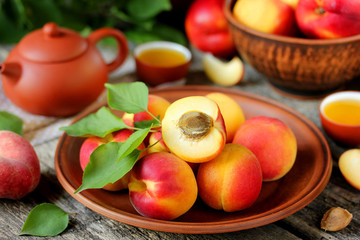 Fresh fruit apricots with leaves on a wooden table