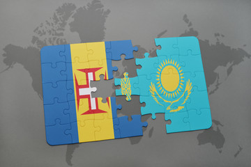puzzle with the national flag of madeira and kazakhstan on a world map background.