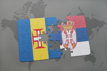 puzzle with the national flag of madeira and serbia on a world map background.