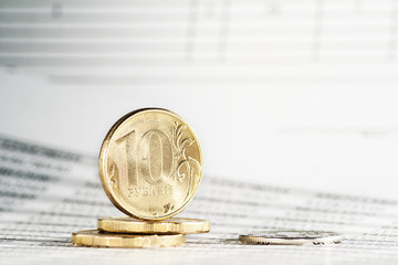 Russian coins in the background documents.