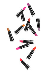 lipsticks falls down in random order on white background