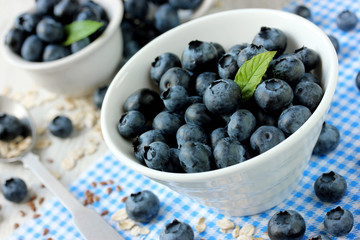 Freshly picked blueberries on white table