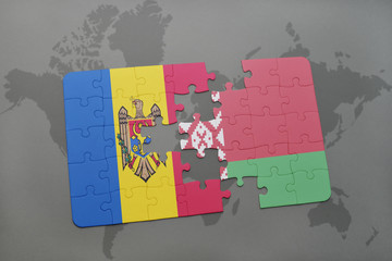 puzzle with the national flag of moldova and belarus on a world map background.