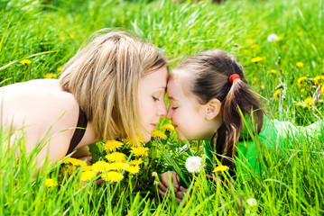 Happy Family takes Fun on Flowers Meadow in Summer - Healthy Lifestyle