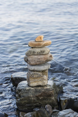 Fototapeta na wymiar some stones on each other with sea